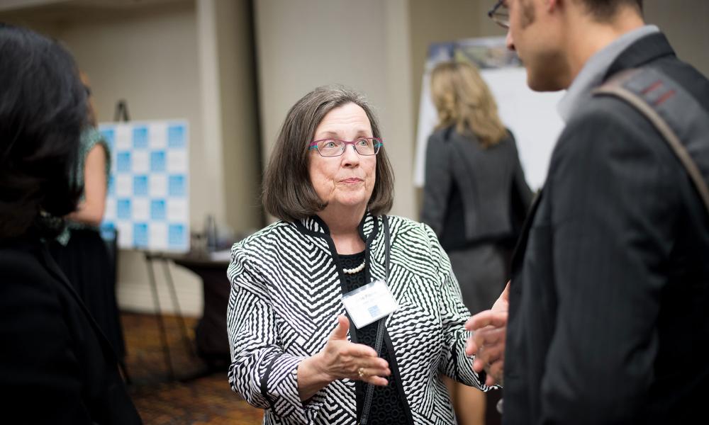 ABAG President Julie Pierce talks with community members at the Plan Bay Area 2040 open house in Walnut Creek .