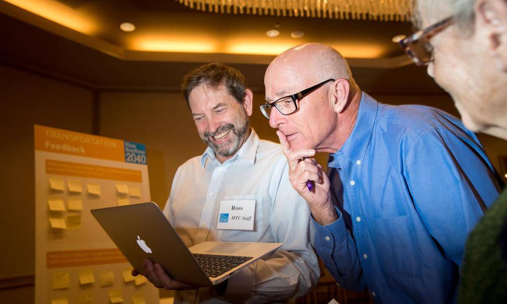 MTC staff member Ross McKeown (left) shows local conditions to an attendee.